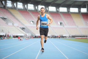 Full length portrait of a man running a race