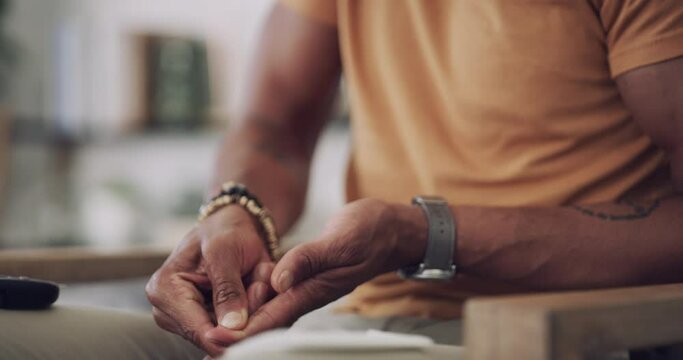 Blood sugar, diabetes monitor and man finger in a home living room checking insulin levels. Male person, house and lounge sofa with digital glucose meter for health monitoring and hands test closeup