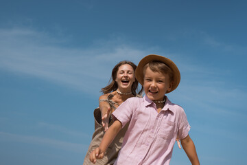 Obraz premium Mother and son having fun together outdoors in summer
