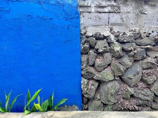 Blue wall and stone wall half and half