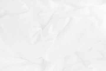 Texture of white blanket and bedding sheet with crumpled or messy in bedroom after wake up.