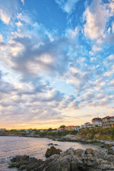 Fototapeta na wymiar sunrise at the sea. gorgeous seaside scenery with clouds on the sky. vacation in sozopol