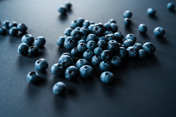Fresh blueberries on a dark background