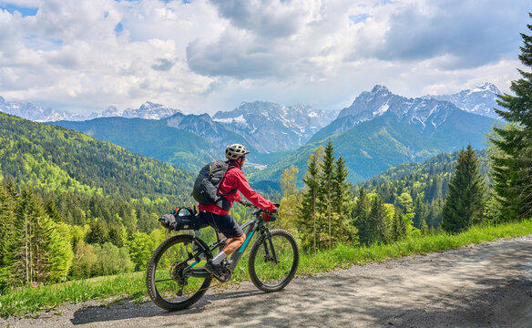 active senior woman on a mountain bike tour in the Julian Alps above Kranska Gora in Slovenia © Uwe