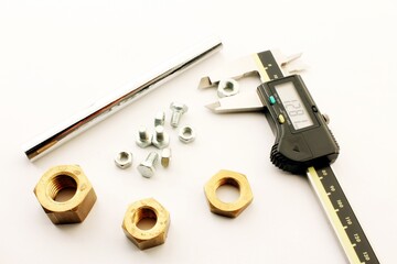 He's using manual caliper device. Closeup of metal processing plant inspecting certain pieces of...