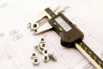 He's using manual caliper device. Closeup of metal processing plant inspecting certain pieces of...