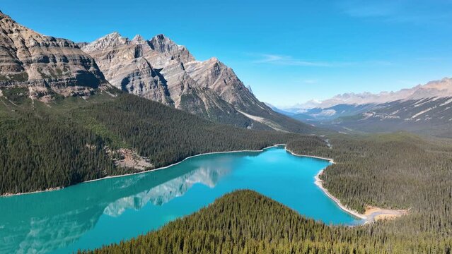 Lake Peyto, Banff National Park, Alberta, Canada. A huge panorama of Landscape during daylight hours. A lake in a river valley. Mountains and forest. Natural landscape.