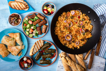 Traditional greek food on a blue wooden background.Flat lay