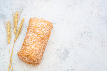 Italian Ciabatta bread on white background. Top view with space for text.
