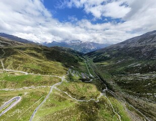 Fototapeta na wymiar Panoramic view of the scenic alpine Spluegen Pass, Switzerland. Aerial view 