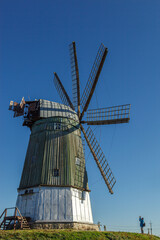 Fototapeta na wymiar windmill dutch type against blue sky