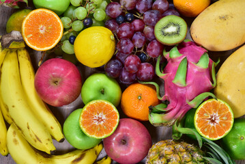 assorted fruits, top view healthy food concept Including high vitamin fruits, fresh fruits, tropical fruits