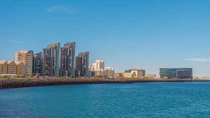 Reykjavik, Iceland – Panoramic view over historical modern downtown in Reykjavik at seaside. Cityscape with skyline at sunny day and blue sky.