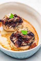champignongs stuffed with onion and dry tomatoes