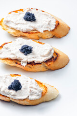 toasted baguette with tuna spread and black caviar