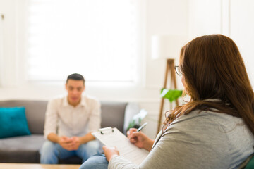 Fototapeta premium Woman therapist talking about a patient with depression