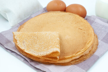 Fototapeta na wymiar Pancakes and ingredients for cooking