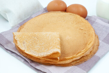 Pancakes and ingredients for cooking