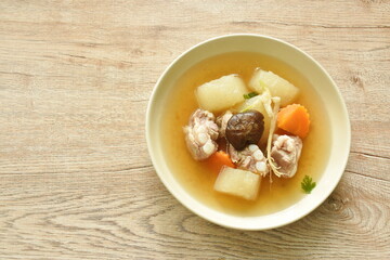 boiled winter melon pork bone with carrot and mushroom soup on plate