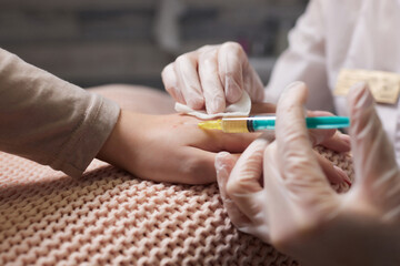 Doctor doing stem cell therapy on a patient's elbow after the injury. Treating knee pain with...