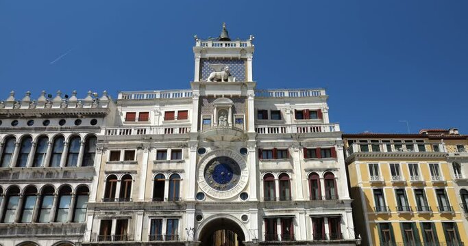 Bright blue sky over the square Piazza San Marco. View of the Clocktower and Procuratie Vecchie. Venice, Italy.