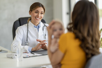 Mother with her cute baby visiting pediatrician in clinic