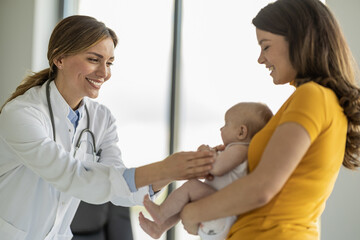Doctor pediatrician and baby patient in clinic