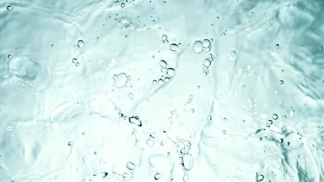 Clear water surface texture with splashes and bubbles.