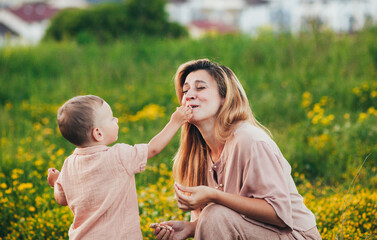 mom and baby on a walk in the mountains