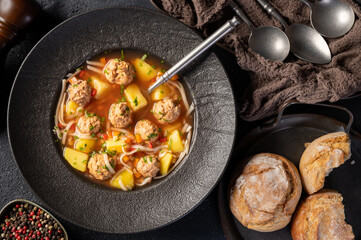 Plate with meatballs soup, traditional plate of the Romanian cuisine - Ciorba de perisoare.