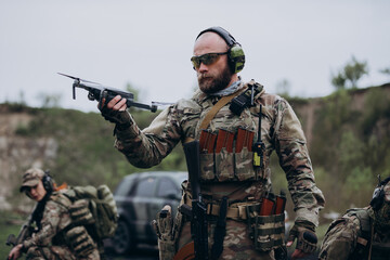 A group of Ukrainian Air Intelligence practicing with a drone