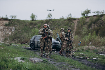 A group of Ukrainian soldiers with a drone