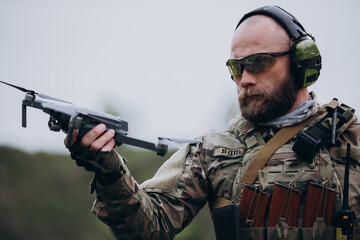 Portrait of Ukrainian Air Intelligence soldier holding a drone
