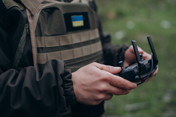 Closeup of Ukrainian military man controlling the drone
