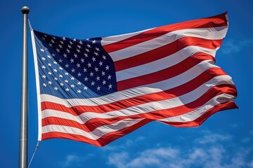 Obraz premium A powerful image of an American flag waving proudly in the wind against a clear blue sky. Generative AI