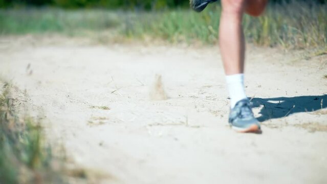 marathon runner doing cardio cross training by running on trail	