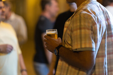 Man holding a beer at the party