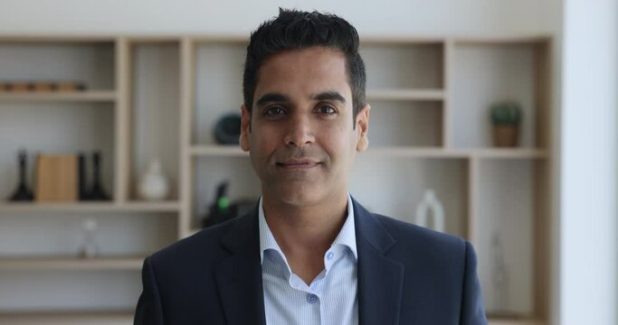 Head shot portrait of middle-aged businessman, leader, company owner. Confident mature 50s businessman, CEO or executive manager in suit look at camera pose at workplace smile relish business success