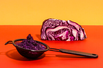Strainer with pulp of red cabbage after juice extraction