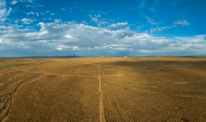 Fototapeta na wymiar Horizons Unveiled: Majestic Peaks and Desert Canvas in the Mojave