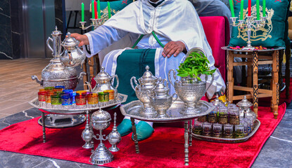 Moroccan man preparing Maghrebi mint tea