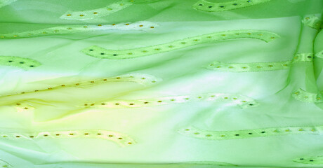 Seamless kaleidoscope. Fabric silk green-blue shades. Vibrant colors and scalloped shapes create a...