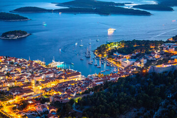 Aerial view of Hvar rooftops and harbor evening view