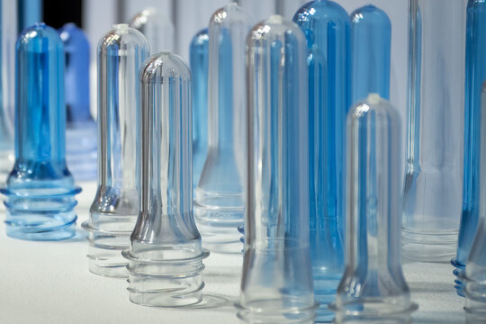 Close up scene of group of preform shape of PET bottle products.
