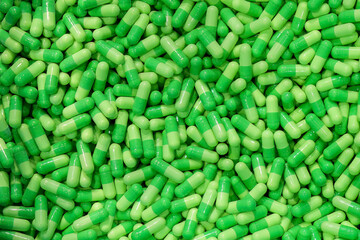 The piles of green capsules pill.
