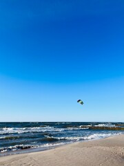 Blue seascape, waves on the sea, sandy coastline, empty beach