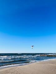 Blue seascape, waves on the sea, sandy coastline, empty beach