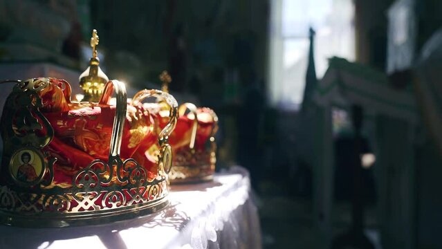 Closeup of golden crowns in an ortodox church during wedding matrimony