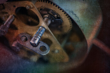 The clock mechanism of an antique alarm clock in a Gothic, grunge creative style.