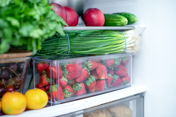 Open fridge full of fresh fruits and vegetables, vegetarian food healthy food background, greenery,...